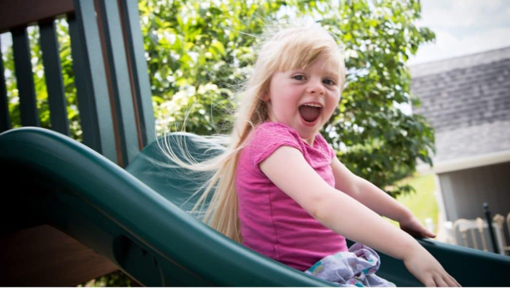 kid on slide