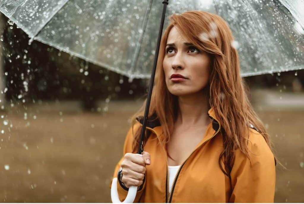 woman standing in rain