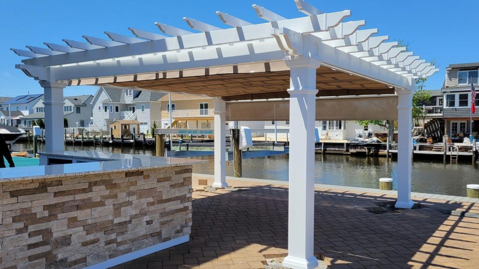 16x16 Artisan White Vinyl Pergola, 8x8 posts, Linen Tweed Canopy, Stucco Side Curtain