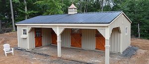 3-stall-shedrow-barn-with-partially-enclosed-overhang-metal-roof